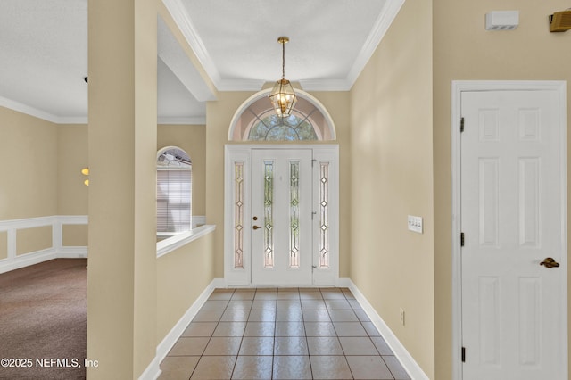 445 W Mill Chase Ct, Ponte Vedra Beach, FL 32082 - entrance foyer with ornamental molding, a chandelier, tile patterned floors, and baseboards