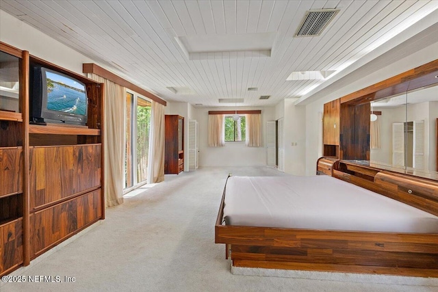 7868 Woodsdale Ln, Jacksonville, FL 32256 - bedroom with wood ceiling, carpet floors, and access to outside