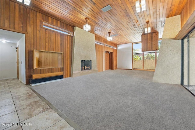 7868 Woodsdale Ln, Jacksonville, FL 32256 - unfurnished living room with wood walls, a large fireplace, and wooden ceiling
