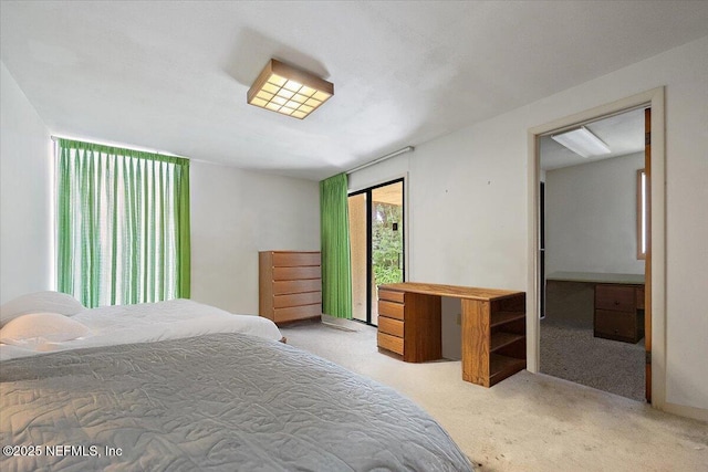 7868 Woodsdale Ln, Jacksonville, FL 32256 - carpeted bedroom featuring access to exterior