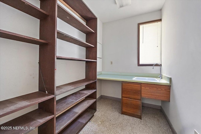 7868 Woodsdale Ln, Jacksonville, FL 32256 - unfurnished office featuring a sink, light colored carpet, and baseboards