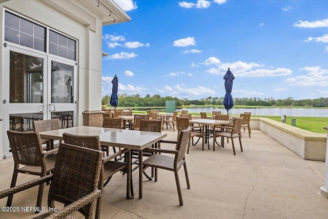 7868 Woodsdale Ln, Jacksonville, FL 32256 - view of patio featuring outdoor dining area and a water view