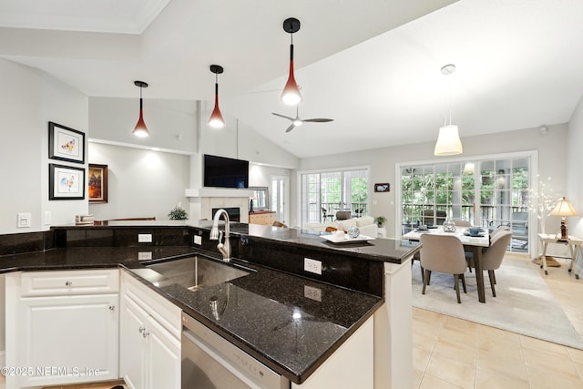 kitchen with a sink, dishwasher, light tile patterned flooring, a ceiling fan, and white cabinets