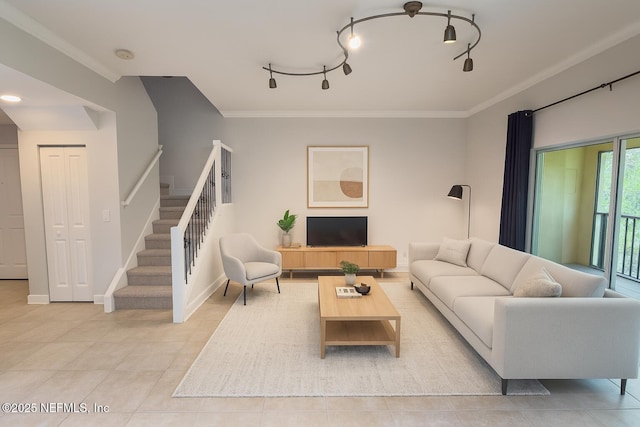9745 Touchton Rd Unit 1929, Jacksonville, FL 32246 - living room featuring stairs, light tile patterned floors, ornamental molding, and rail lighting