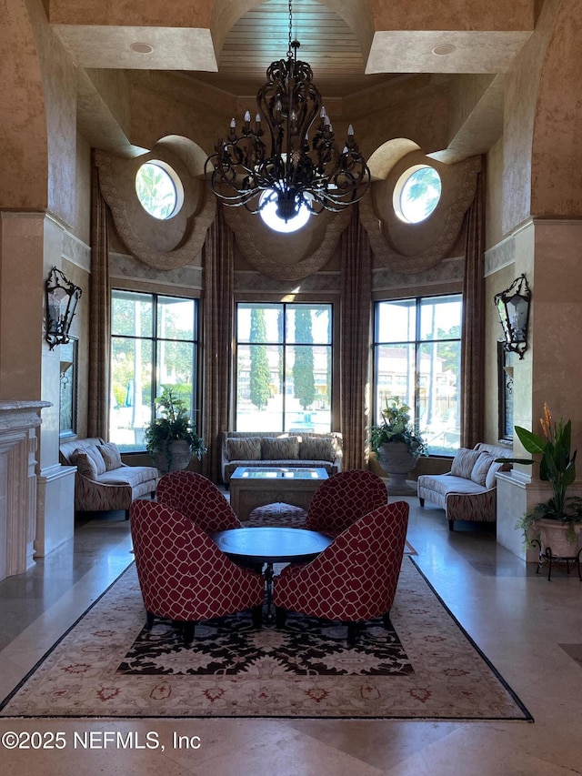 9745 Touchton Rd Unit 1929, Jacksonville, FL 32246 - living area featuring healthy amount of natural light, a chandelier, and a high ceiling