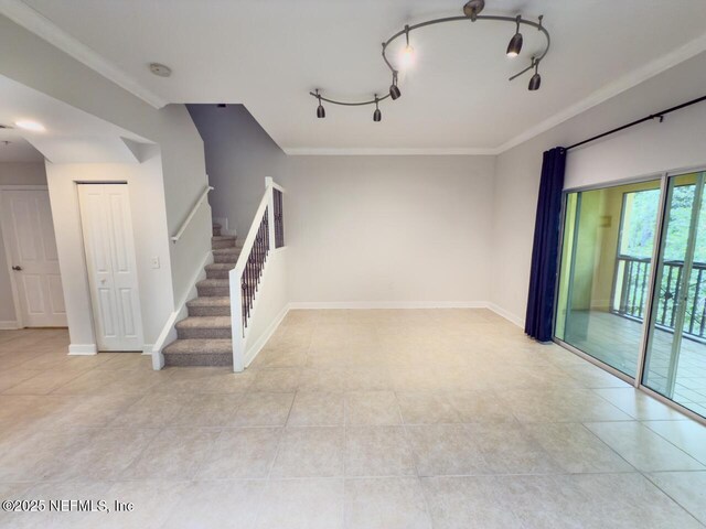9745 Touchton Rd Unit 1929, Jacksonville, FL 32246 - unfurnished living room with stairway, light tile patterned floors, and crown molding
