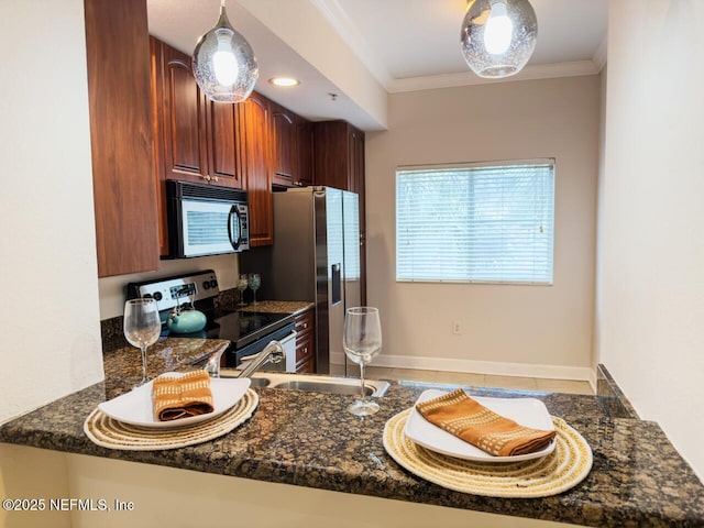 9745 Touchton Rd Unit 1929, Jacksonville, FL 32246 - kitchen featuring appliances with stainless steel finishes, crown molding, tile patterned flooring, dark stone countertops, and a peninsula