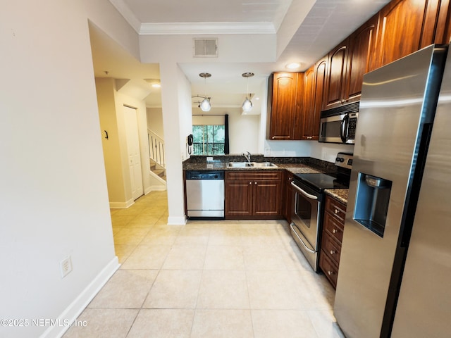 9745 Touchton Rd Unit 1929, Jacksonville, FL 32246 - kitchen with stainless steel appliances, ornamental molding, light tile patterned floors, dark stone countertops, and pendant lighting