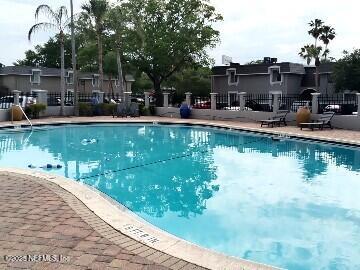 community pool featuring fence