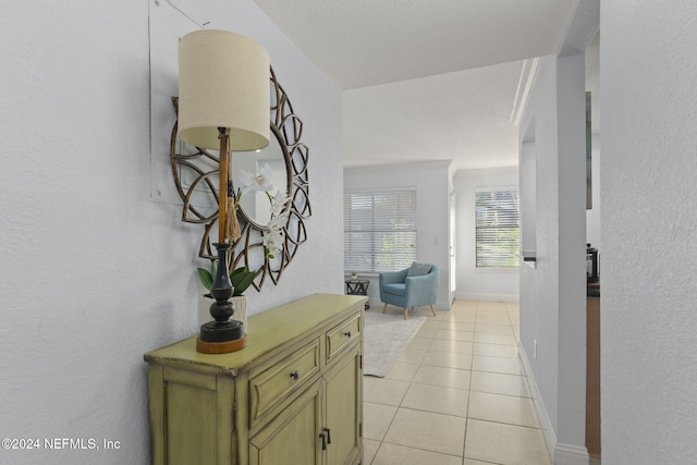 858 Shoreline Cir, Ponte Vedra Beach, FL 32082 - hall featuring light tile patterned flooring, baseboards, and a textured wall