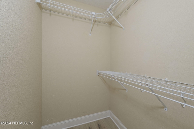 858 Shoreline Cir, Ponte Vedra Beach, FL 32082 - walk in closet featuring wood finished floors