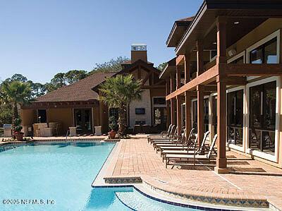 858 Shoreline Cir, Ponte Vedra Beach, FL 32082 - community pool featuring a patio area