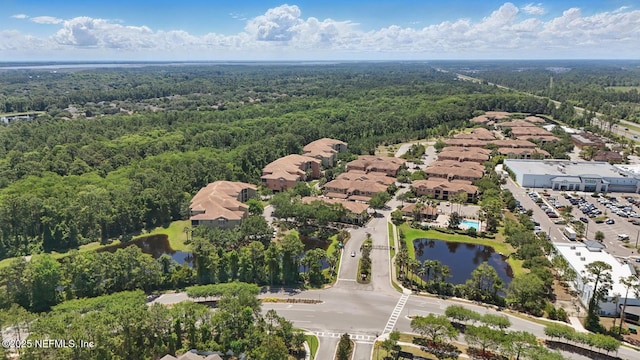 200 Paseo Terraza Unit 203, Saint Augustine, FL 32095 - aerial perspective of suburban area featuring a heavily wooded area and a large body of water