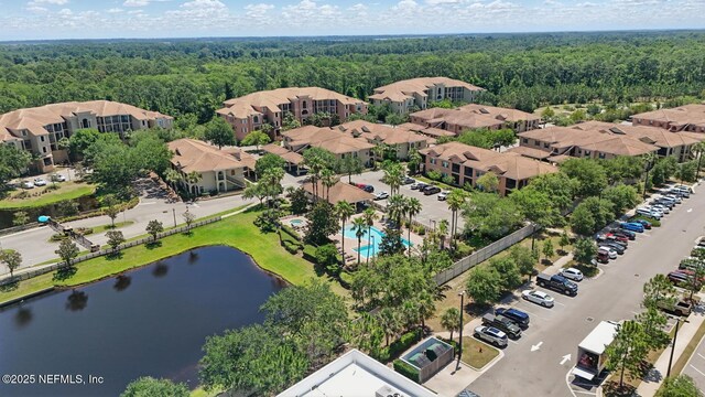 200 Paseo Terraza Unit 203, Saint Augustine, FL 32095 - aerial view of a forest, a large body of water, and a pool area