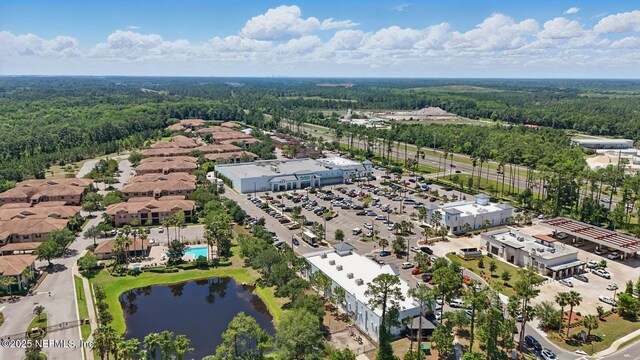 200 Paseo Terraza Unit 203, Saint Augustine, FL 32095 - drone / aerial view of a forest and a nearby body of water