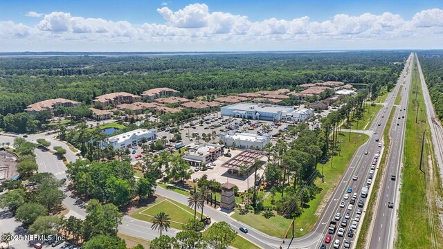 200 Paseo Terraza Unit 203, Saint Augustine, FL 32095 - drone / aerial view of a main thoroughfare and a heavily wooded area