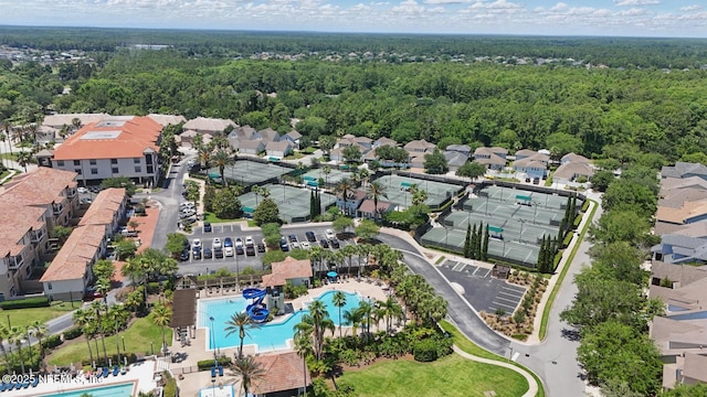 200 Paseo Terraza Unit 203, Saint Augustine, FL 32095 - view of property location featuring a pool area, a forest, and nearby suburban area