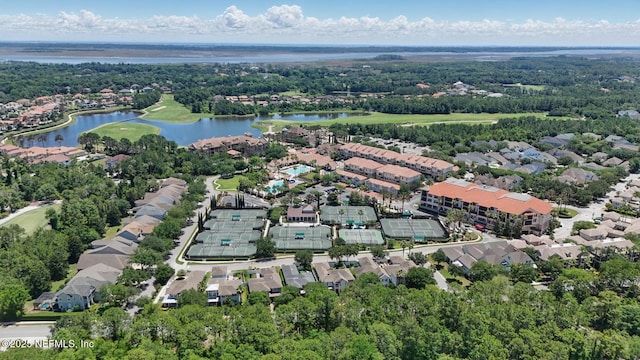 200 Paseo Terraza Unit 203, Saint Augustine, FL 32095 - aerial view of residential area with a large body of water, a golf course, and a tree filled landscape