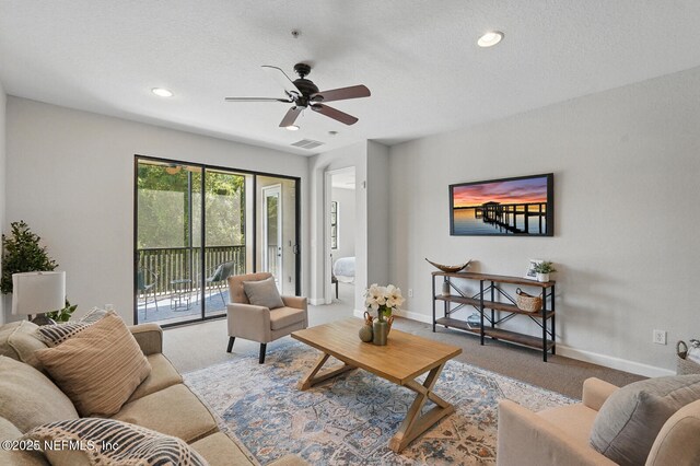 200 Paseo Terraza Unit 203, Saint Augustine, FL 32095 - carpeted living area with a ceiling fan, baseboards, recessed lighting, and a textured ceiling