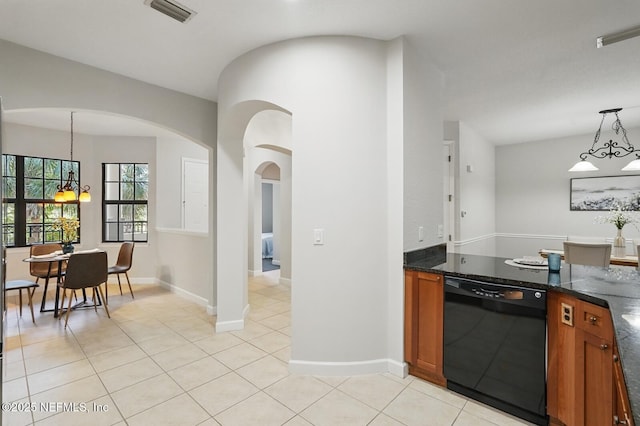 200 Paseo Terraza Unit 203, Saint Augustine, FL 32095 - kitchen featuring dishwasher, a chandelier, brown cabinets, and light tile patterned floors