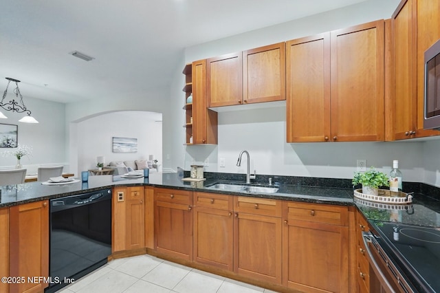 200 Paseo Terraza Unit 203, Saint Augustine, FL 32095 - kitchen featuring dishwasher, a sink, arched walkways, dark stone countertops, and brown cabinets