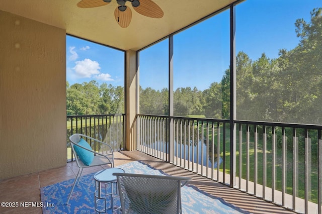200 Paseo Terraza Unit 203, Saint Augustine, FL 32095 - sunroom / solarium featuring ceiling fan and view of scattered trees