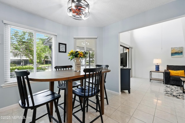 9360 Craven Rd Unit 1406, Jacksonville, FL 32257 - dining area featuring light tile patterned flooring and a textured ceiling