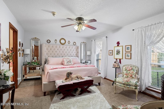 3041 Marrano Dr, Orange Park, FL 32073 - bedroom featuring carpet, a textured ceiling, ceiling fan, and baseboards