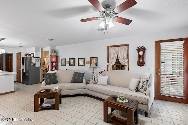 3041 Marrano Dr, Orange Park, FL 32073 - living area with light tile patterned floors and ceiling fan