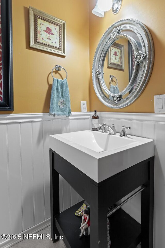 3041 Marrano Dr, Orange Park, FL 32073 - bathroom with wainscoting and vanity