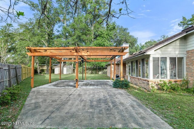 3041 Marrano Dr, Orange Park, FL 32073 - view of vehicle parking with a storage shed, concrete driveway, and a carport