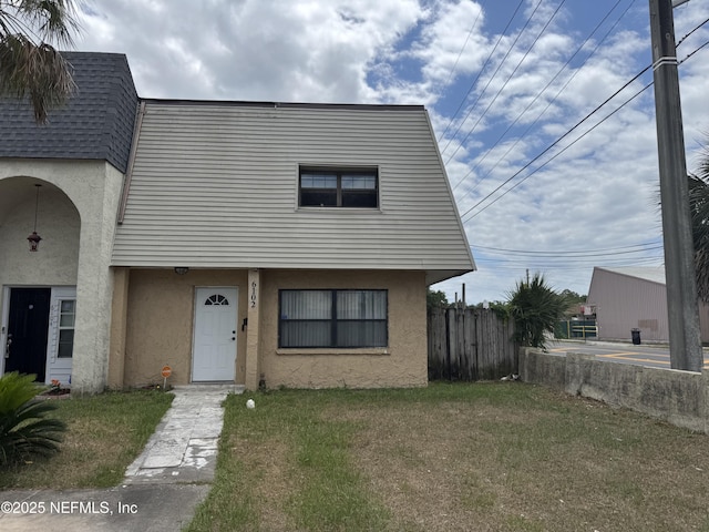 view of front of home featuring stucco siding