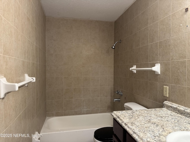 bathroom with  shower combination, toilet, and vanity