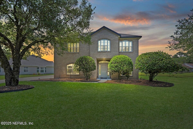 11092 Turnbridge Dr Unit 74, Jacksonville, FL 32256 - view of front of home featuring a yard and brick siding