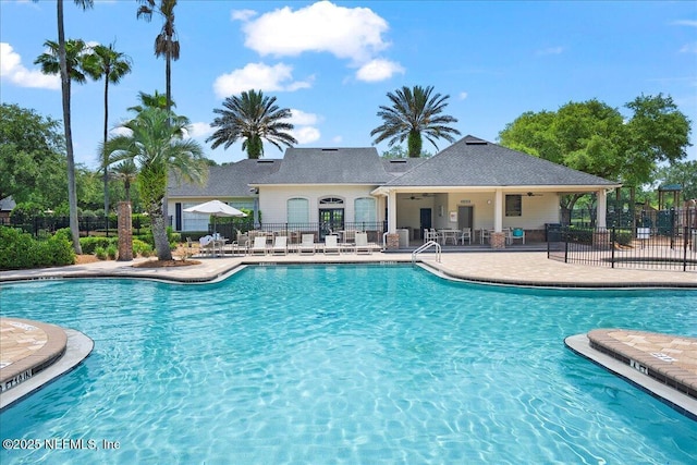 11092 Turnbridge Dr Unit 74, Jacksonville, FL 32256 - community pool with ceiling fan and a patio