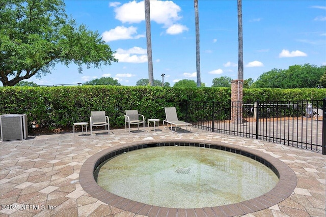 11092 Turnbridge Dr Unit 74, Jacksonville, FL 32256 - view of swimming pool featuring a patio area and a community hot tub