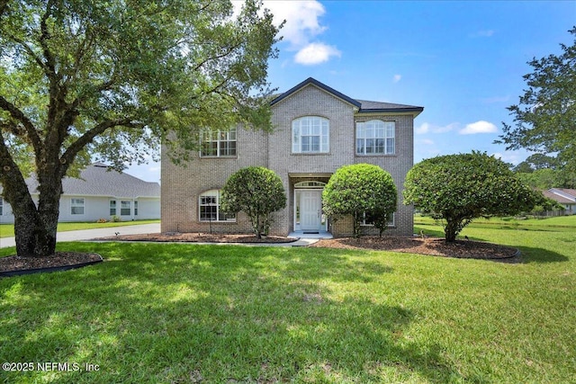 11092 Turnbridge Dr Unit 74, Jacksonville, FL 32256 - traditional home featuring brick siding and a front yard