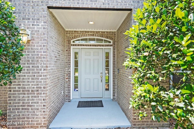 11092 Turnbridge Dr Unit 74, Jacksonville, FL 32256 - view of exterior entry featuring brick siding