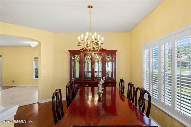11092 Turnbridge Dr Unit 74, Jacksonville, FL 32256 - dining space with arched walkways, healthy amount of natural light, and a chandelier