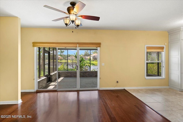 11092 Turnbridge Dr Unit 74, Jacksonville, FL 32256 - spare room featuring wood finished floors, baseboards, and a ceiling fan