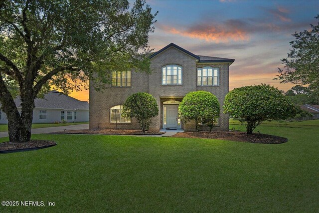 11092 Turnbridge Dr Unit 74, Jacksonville, FL 32256 - view of front of home with a yard and brick siding