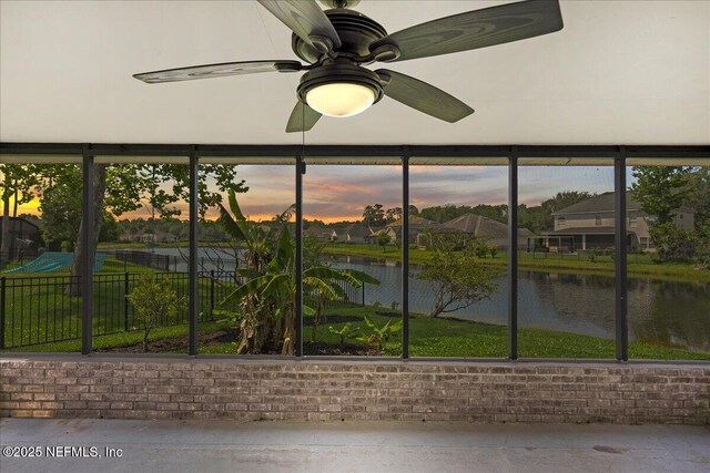 11092 Turnbridge Dr Unit 74, Jacksonville, FL 32256 - unfurnished sunroom featuring a water view, a ceiling fan, and brick wall