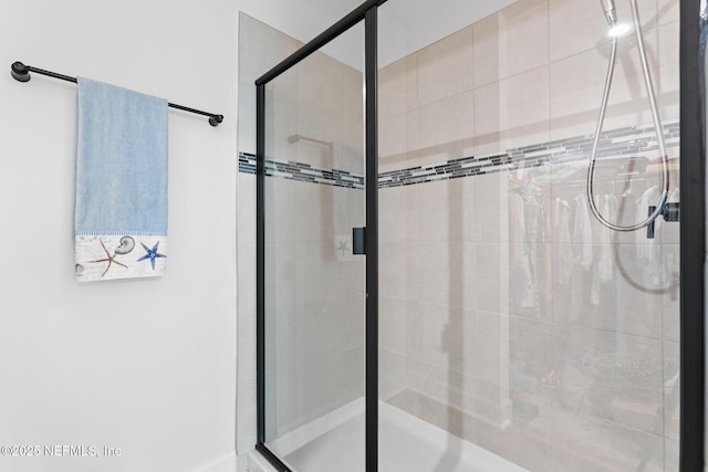full bath with a shower stall