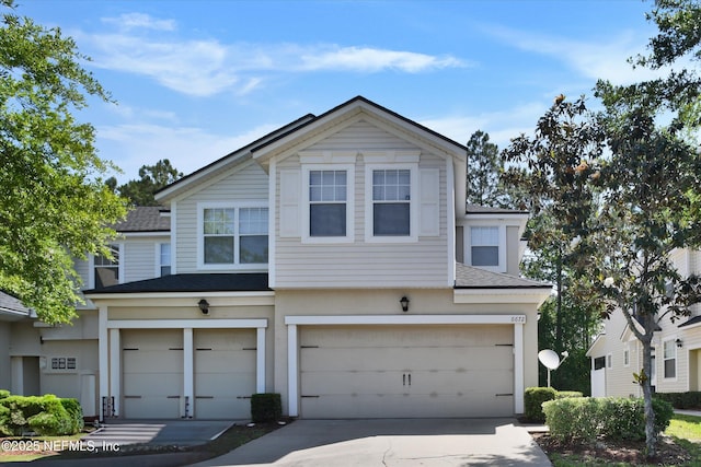 8672 Ribbon Falls Ln, Jacksonville, FL 32244 - multi unit property featuring a shingled roof, a garage, and driveway