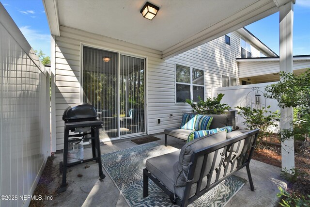 8672 Ribbon Falls Ln, Jacksonville, FL 32244 - view of patio featuring fence, area for grilling, and an outdoor hangout area