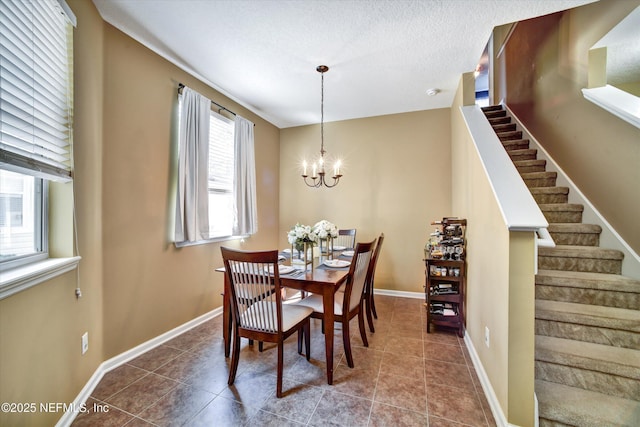 8672 Ribbon Falls Ln, Jacksonville, FL 32244 - tiled dining area with stairway, a chandelier, baseboards, and a textured ceiling