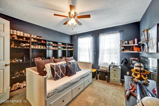 8672 Ribbon Falls Ln, Jacksonville, FL 32244 - bedroom featuring light carpet, a textured ceiling, and a ceiling fan