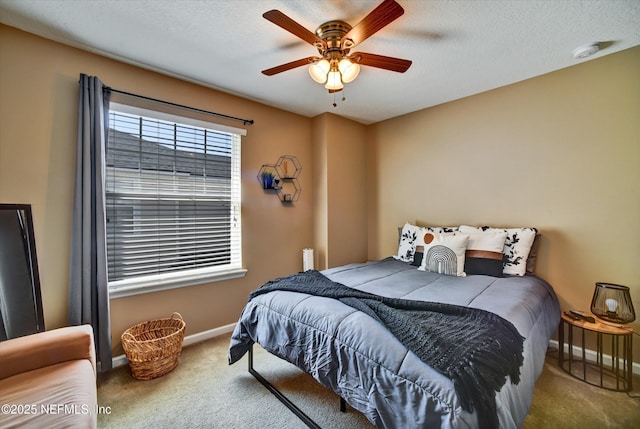 8672 Ribbon Falls Ln, Jacksonville, FL 32244 - bedroom featuring baseboards, carpet flooring, a ceiling fan, and a textured ceiling