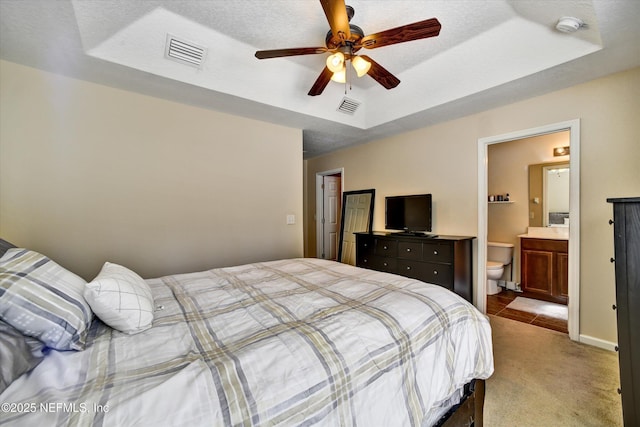 8672 Ribbon Falls Ln, Jacksonville, FL 32244 - bedroom with a raised ceiling, carpet flooring, ensuite bath, and ceiling fan