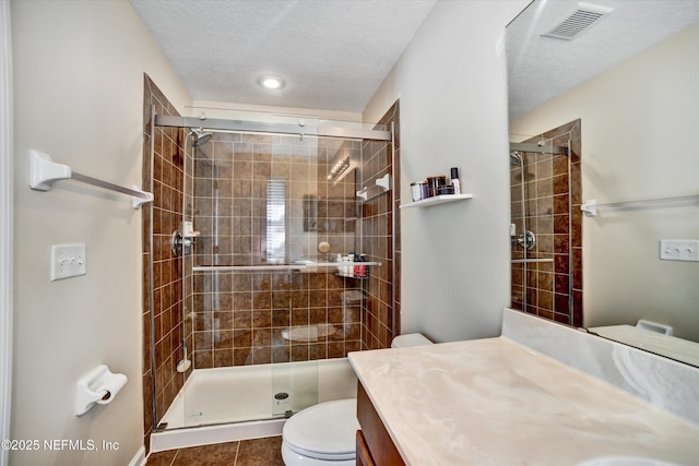 8672 Ribbon Falls Ln, Jacksonville, FL 32244 - bathroom with toilet, a shower stall, vanity, tile patterned flooring, and recessed lighting